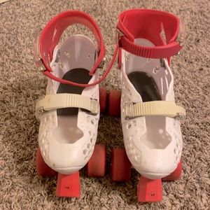 Children’s Track Star pink and white skates.